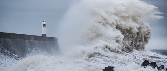 storm hitting lighthouse Porthcawl